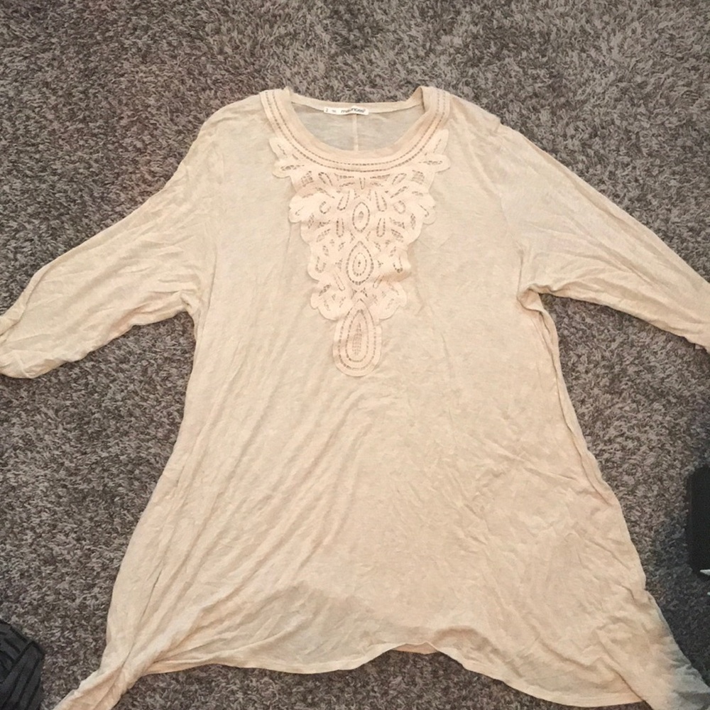 Cream tunic with lace detail around neck